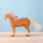 Thumbnail: Bumbu Toys Handcrafted Wooden Brown Horse Figurine Side Viewon a wooden surface