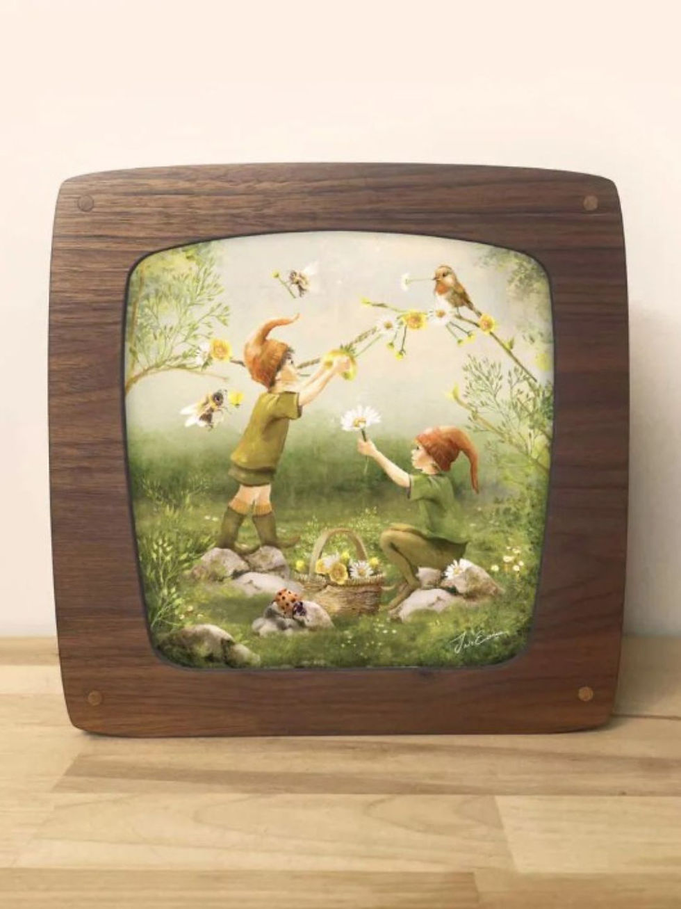Magic Lamp silhouette featuring Iris Esther's "Birds & Bees" artwork of tiny elves in a meadow.