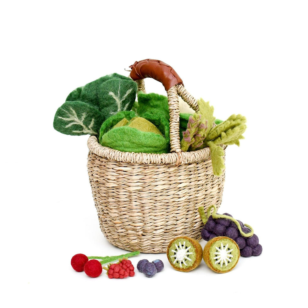 Tara Treasures Felt Lettuce Play Food in a woven basket with other felt vegetables