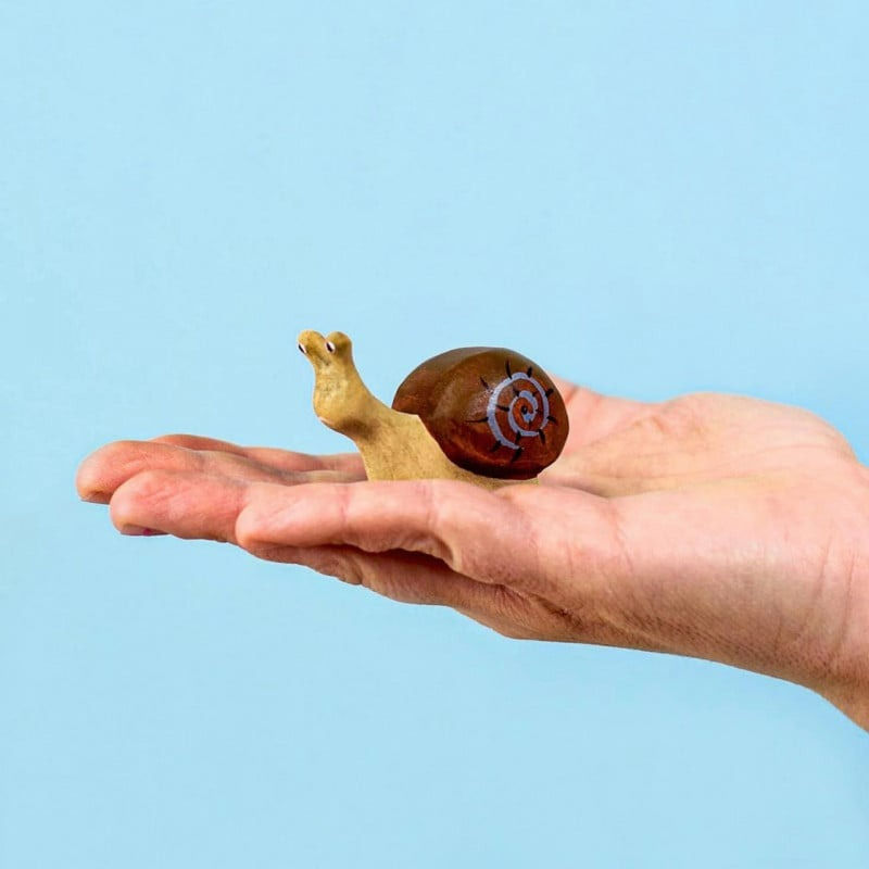 Thumbnail: A Hand Holding the Bumbu Toys Handcrafted Wooden Snail