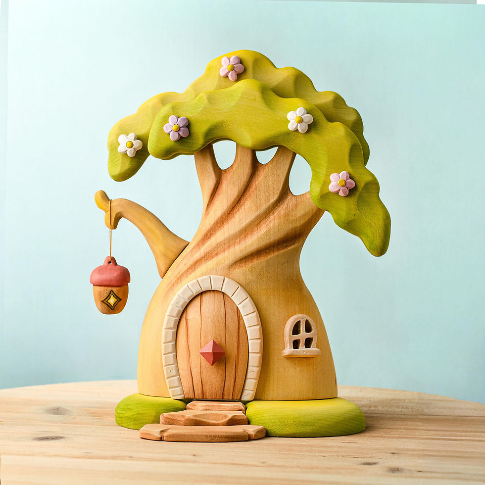 Fairy treehouse on a wooden surface showing the beautiful wood grain and carved door.