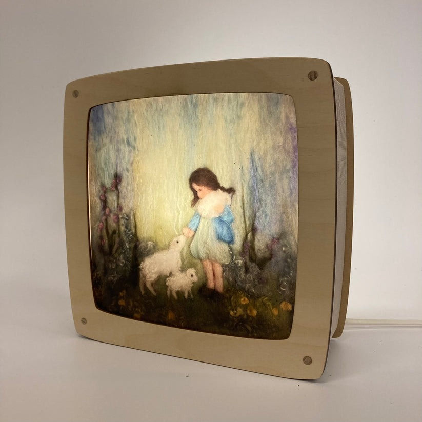 Girl with Lambs Magic Lamp Silhouette by Het Houtlokael glowing in wooden lamp