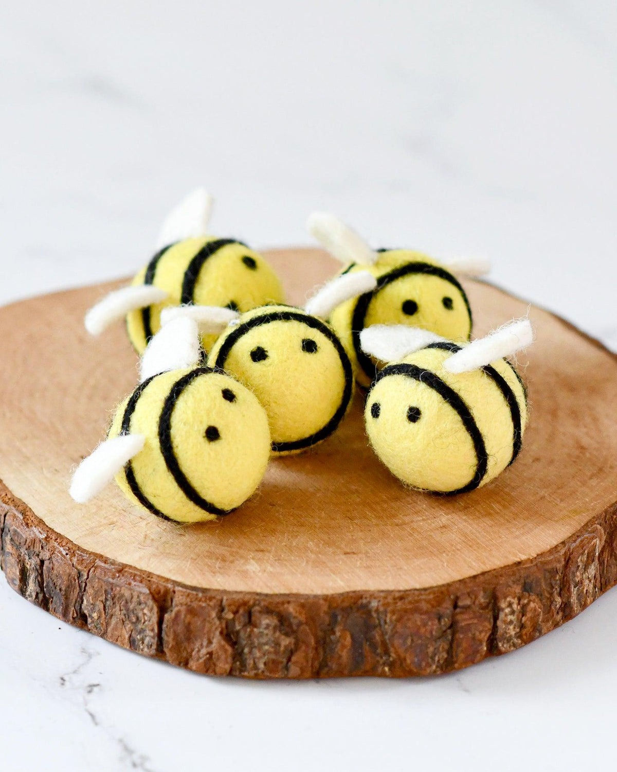 Tara Treasures Felt Bees on a wooden tray