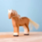 Thumbnail: Bumbu Toys Handcrafted Wooden Brown Horse Figurine on a wooden surface