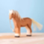 Thumbnail: Bumbu Toys Handcrafted Wooden Brown Horse Figurine Side View on a wooden surface