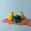 Thumbnail: Bumbu Toys Wooden Pumpkin Patch Set – Yellow, Green, Grey Pumpkins on a hand.