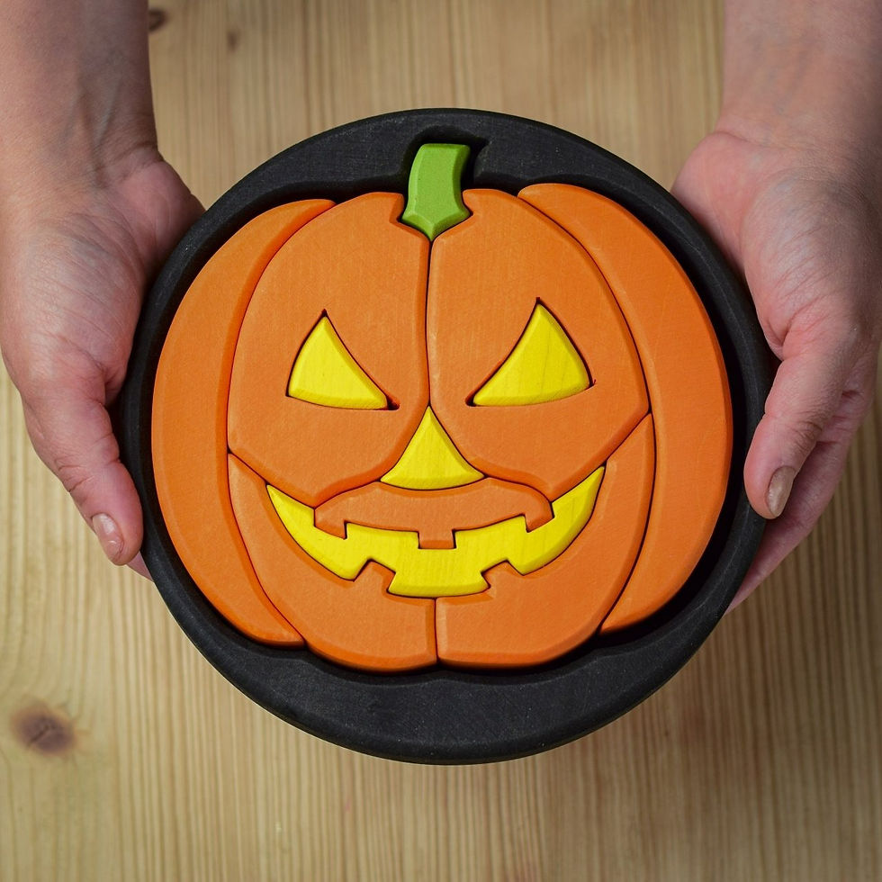 Hands holding the Bumbu Toys small handcrafted wooden round Halloween puzzle.