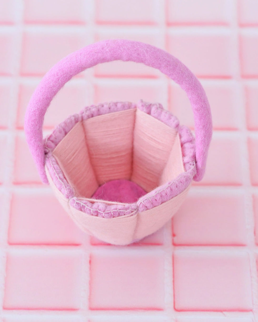 Interior view of petite pink felt Easter basket showing soft wool lining