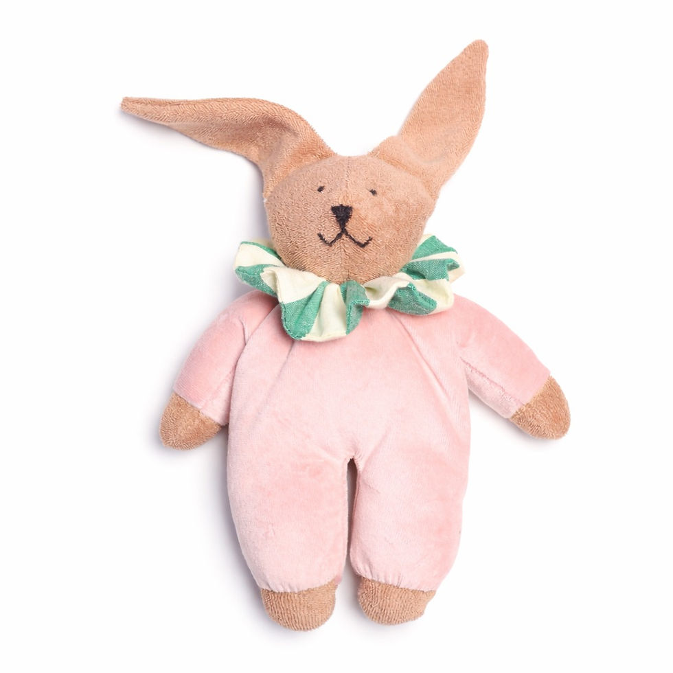 Front view of Nanchen Natur Circus Rabbit Hanni Waldorf doll in a pink suit and green striped collar on a heart blanket.