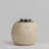 Thumbnail: Small ceramic pet urn with organic imperfect round shape displayed in a professional white studio setting