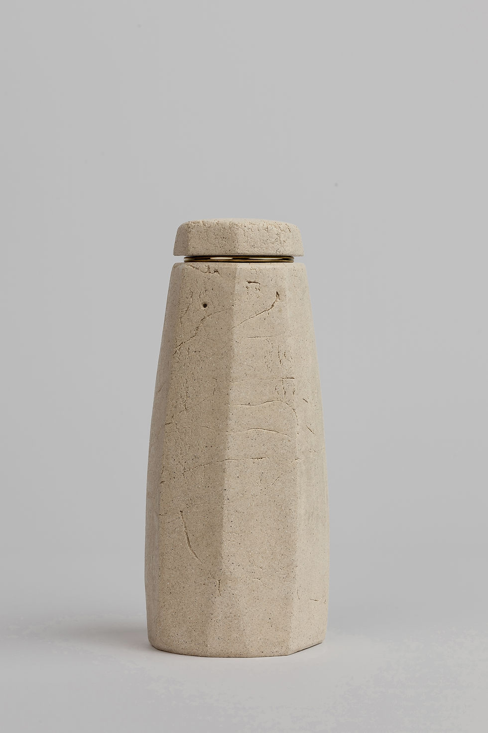 Thumbnail: Medium minimalist ceramic pet urn with vertical, geometric form displayed in a professional white studio setting