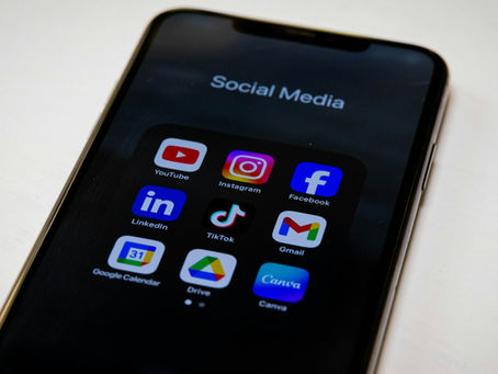 Smartphone displaying social media apps used for music discovery and marketing