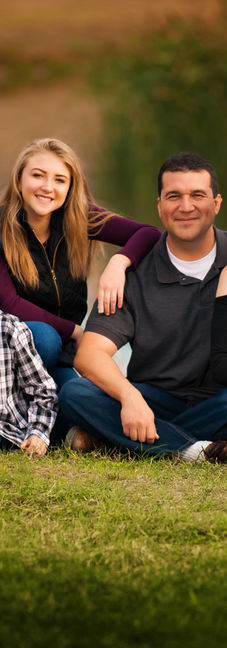 family portrait photography by river with autumn reeds at Cameron Park Waco Texas.