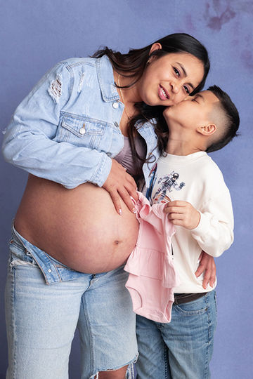 Big brother excited to meet his little sister during maternity session