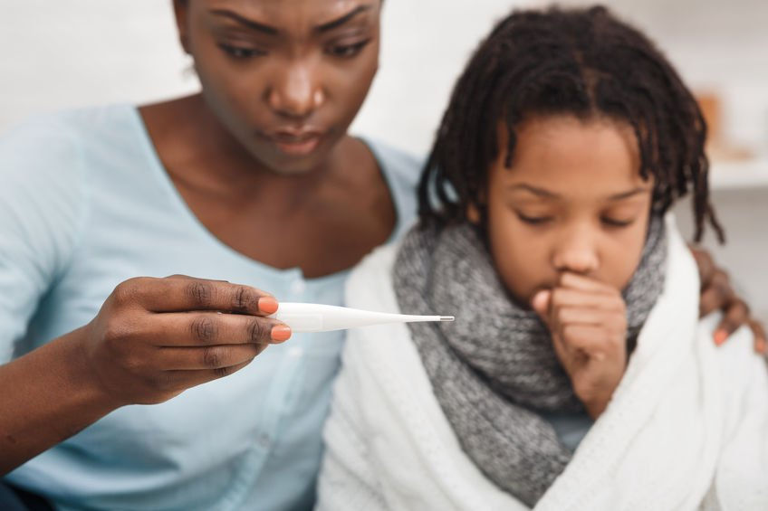 Mom-reading-temp-of-sick-daughter_cough-and-cold.jpg