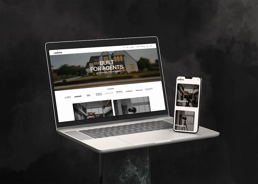 Laptop and phone displaying website for built for clients, dark background.
