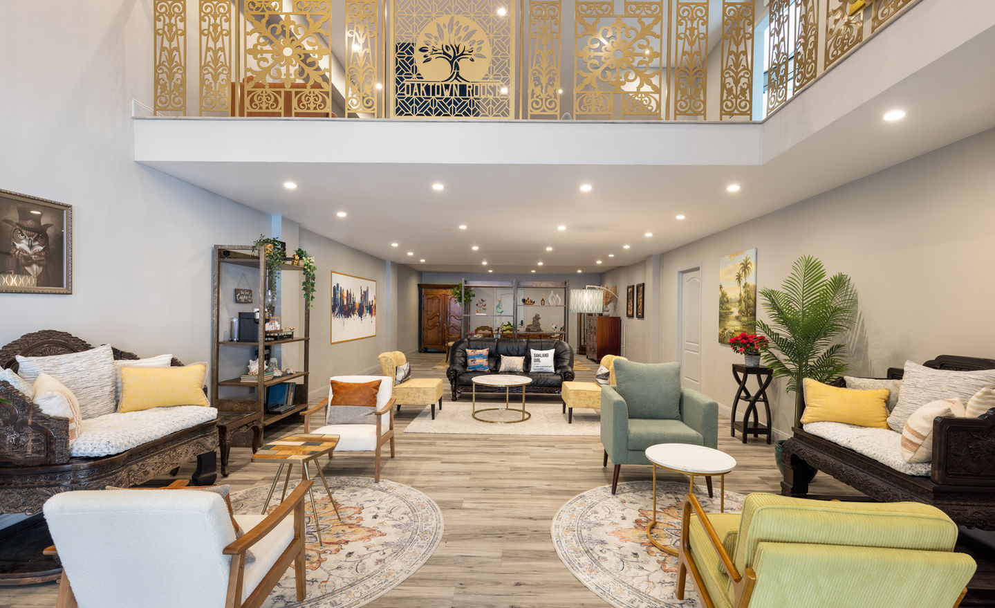 Hotel lounge with diverse seating and ornate golden balcony