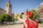 young-woman-tourist-red-dress-with-head-flower-photographing-with-phone-main-cathedral-val