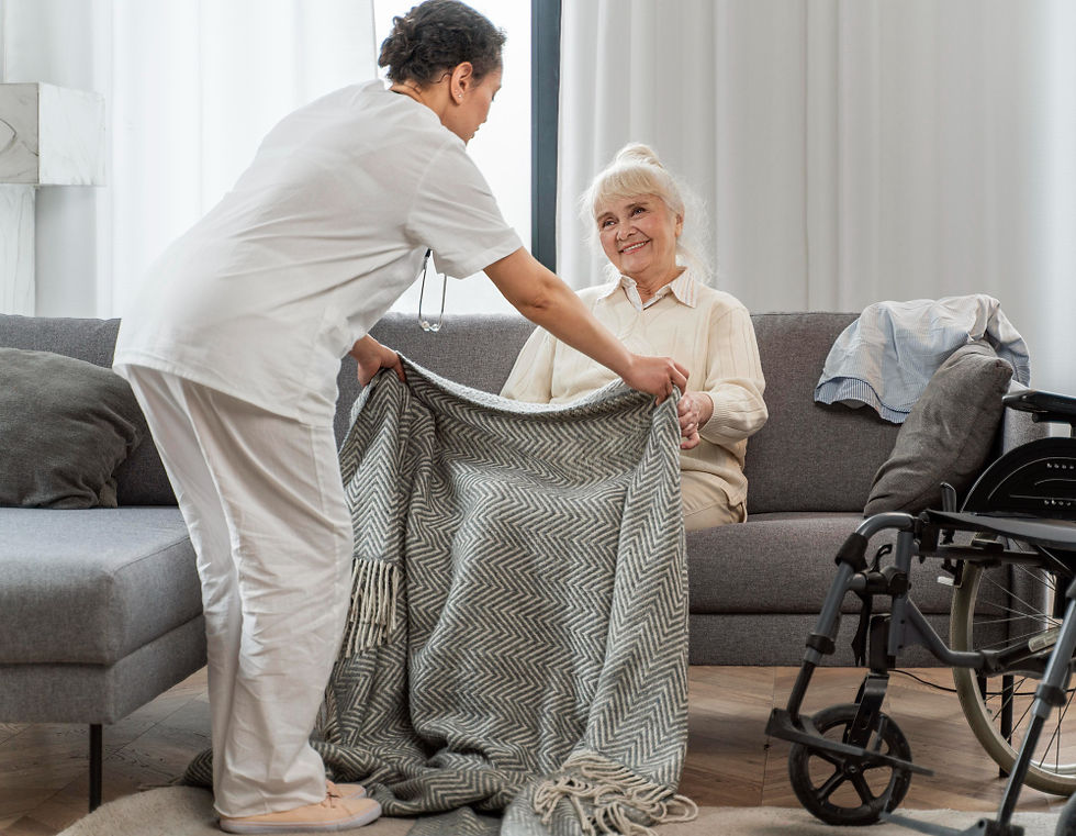 Nurse assisting an elderly woman.