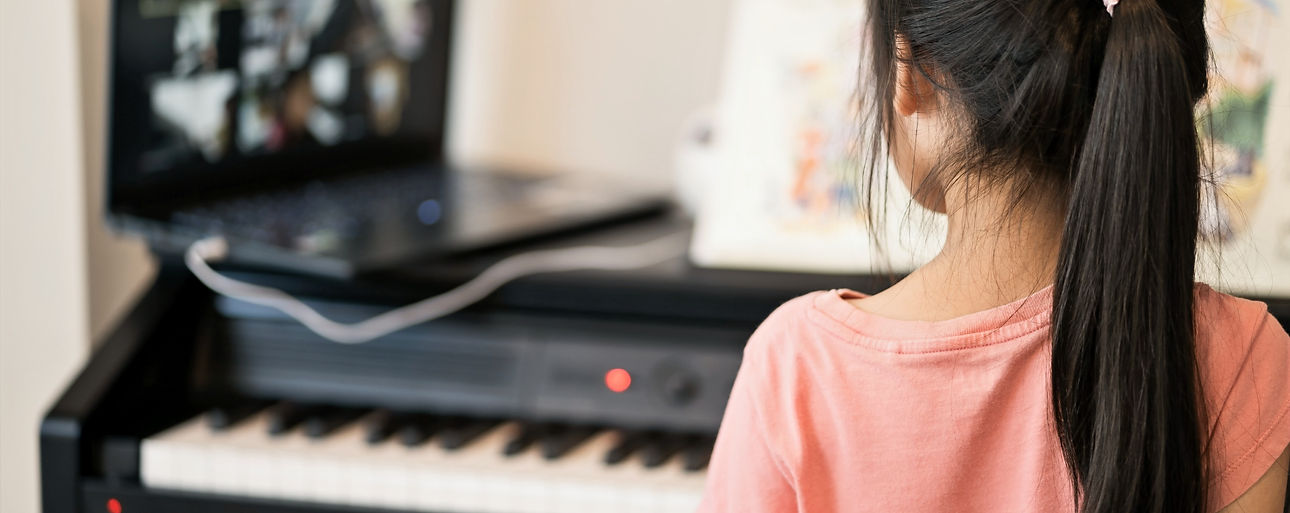 asian-little-girl-learning-piano-from-co