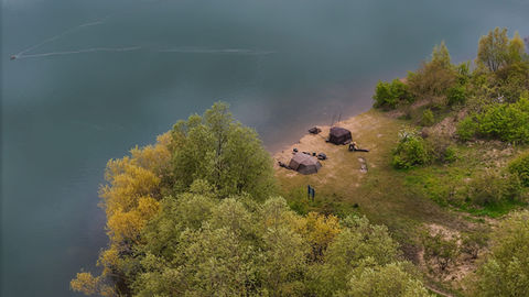 Aerial view of campsite by lake