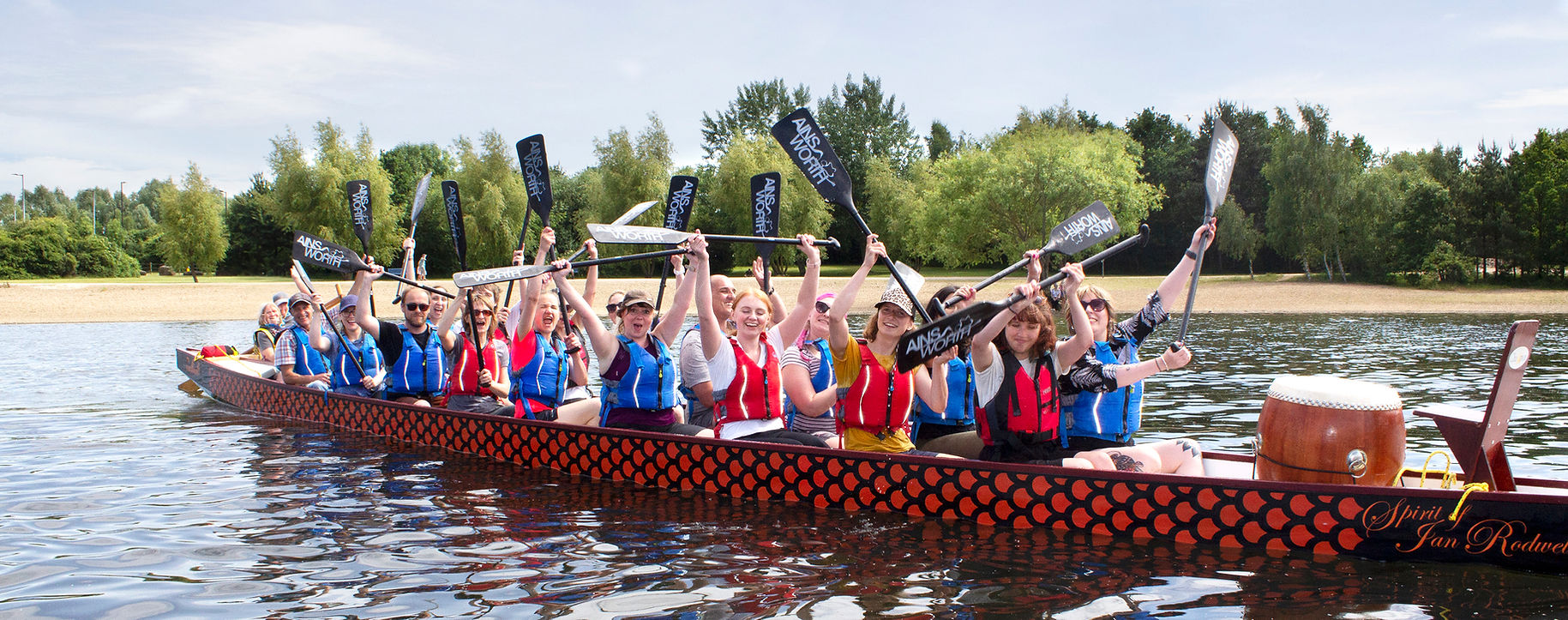 Dragon boat team celebrates victory on lake