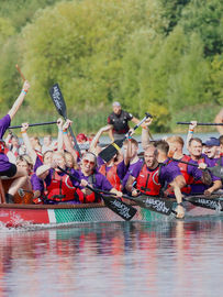 Dragon boat team racing, celebrating