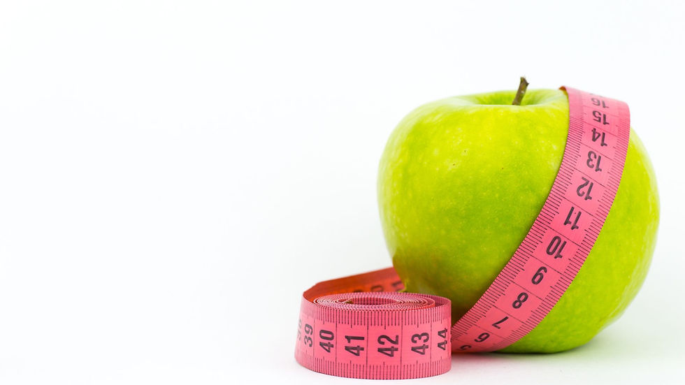 An apple and a tape measure