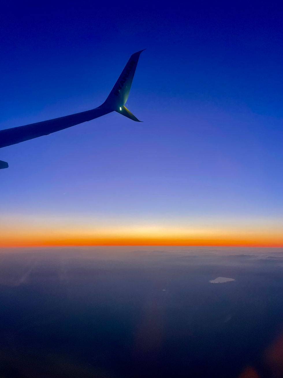 A sunset from a plane window
