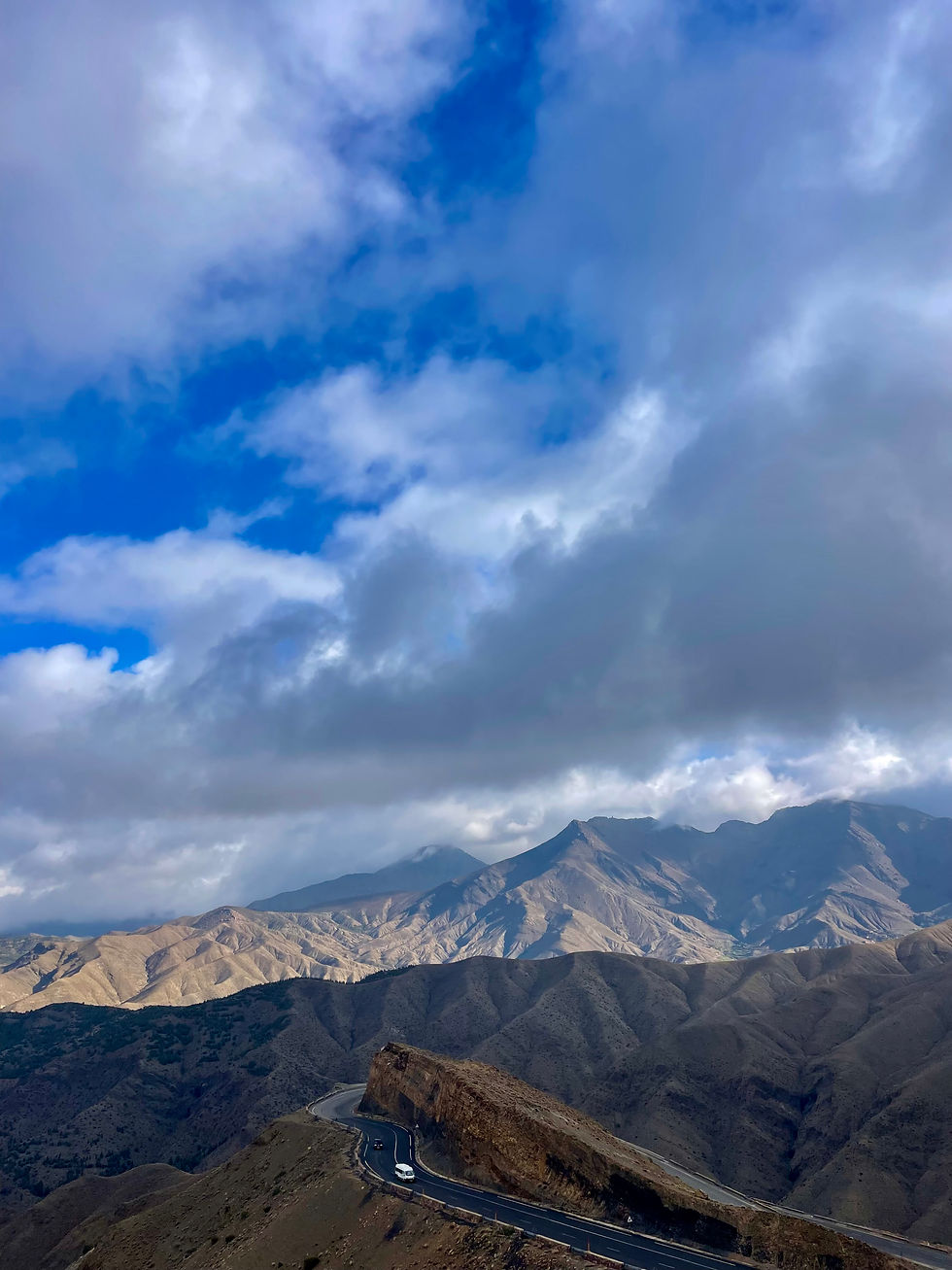 A view of mountains and winding roads in the Atlas Mountains in Morocco