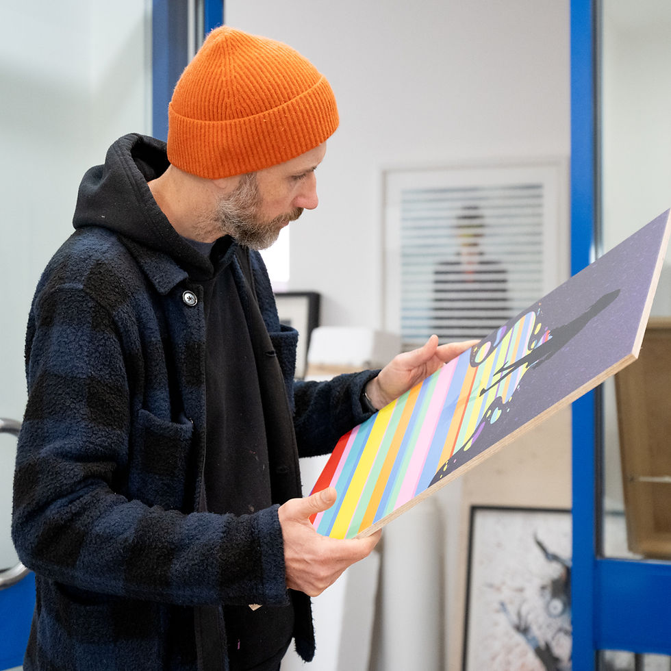 artists looking at digital print on plywood