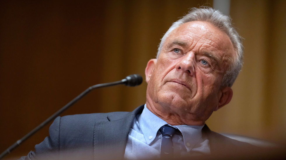 “Health Secretary Robert F. Kennedy Jr. at a Senate hearing, listening intently during discussions over CDC vaccine guidance.”