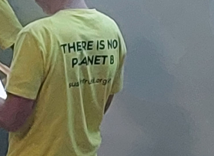 Young man in t-shirt with 'There is no planet B' on it