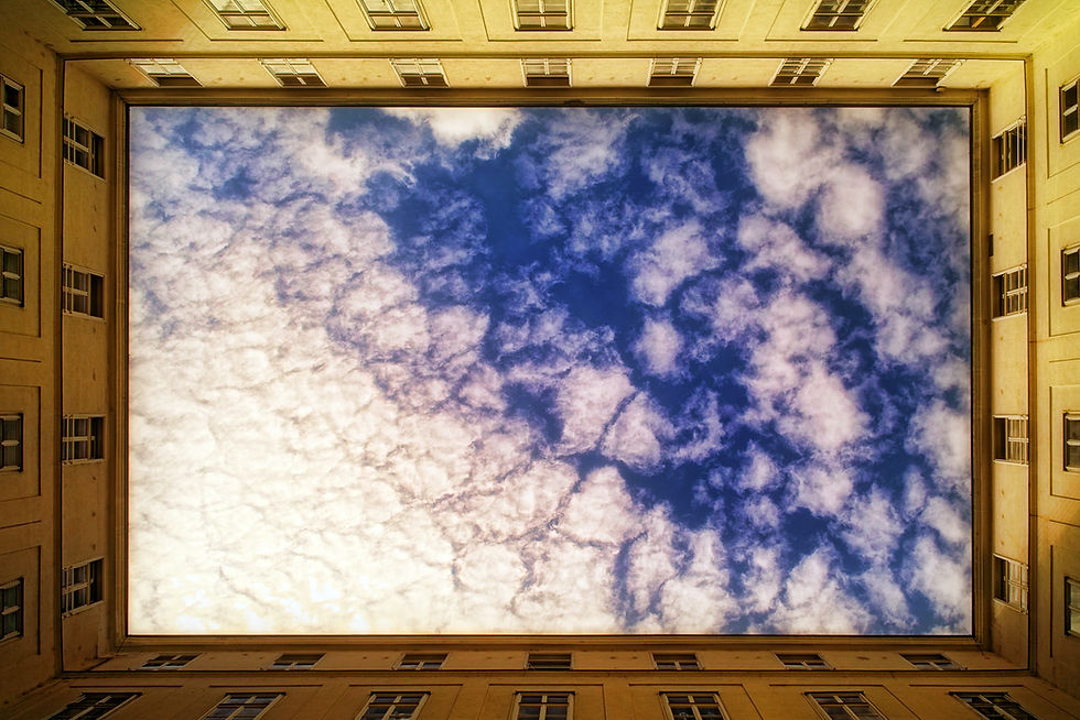 Clouds framed by the building courtyard