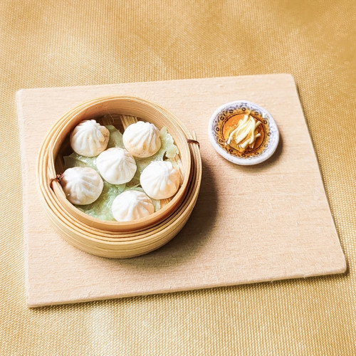 Xiao Long Bao with a plate of ginger strips in vinegar Tingcorner