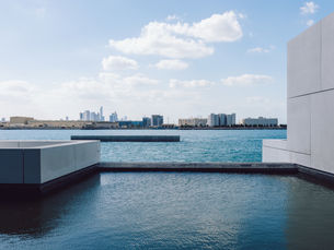 View of city with towers and skyscrapers from Saadiyat Island in Abu Dhabi