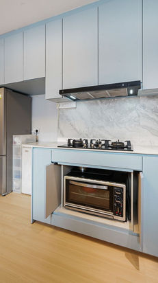 Modern scandinavian featuring open concept kitchen with custom blue kitchen cabinet.