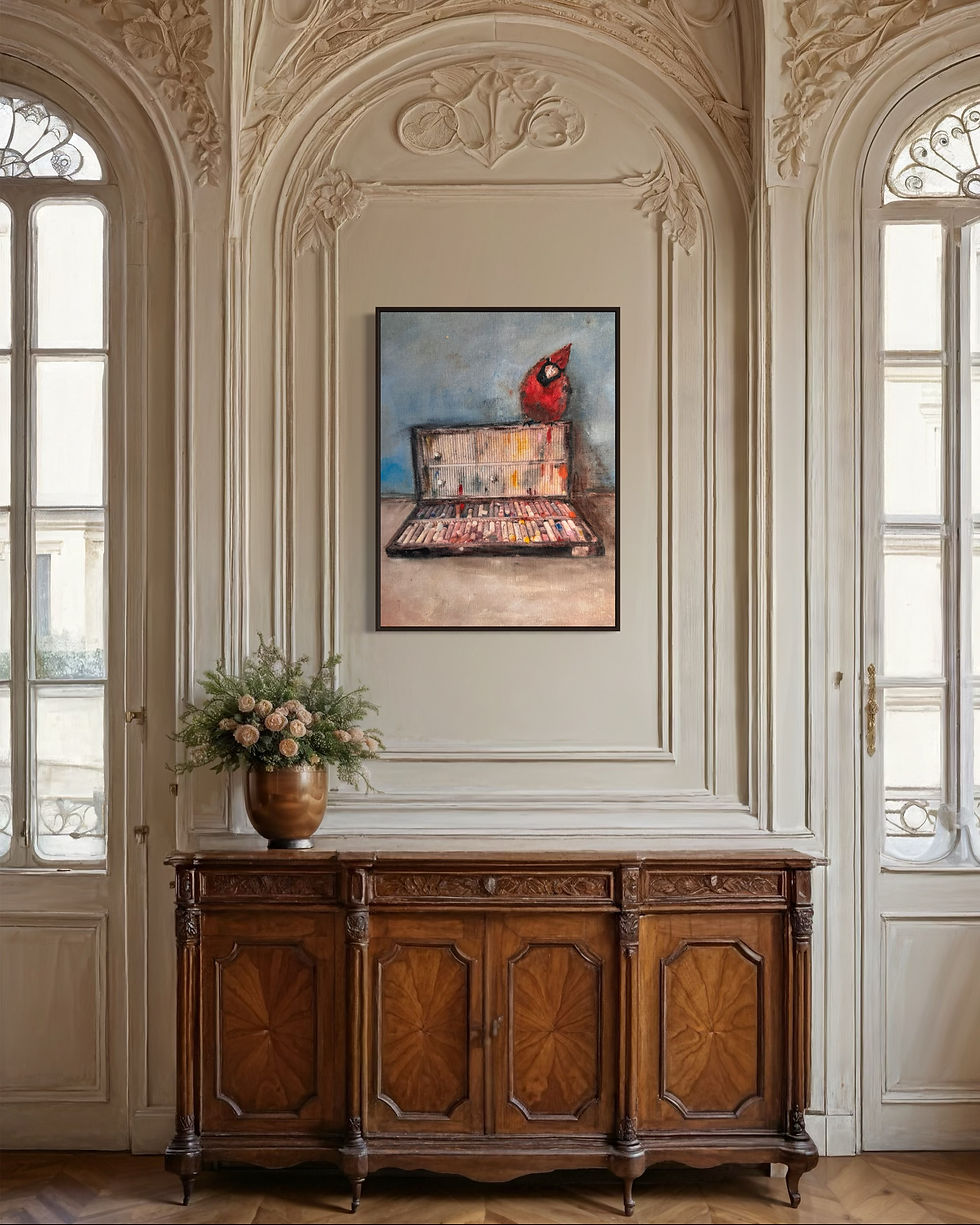 Oil painting of a red cardinal atop an open box of pastel chalks in a frame hanging in a room.
