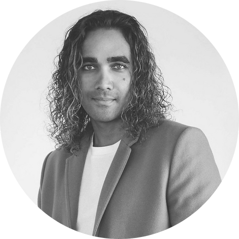 Black & white photo of Brandon Henderson, the owner and photographer at BOHO Boudoir Photography.