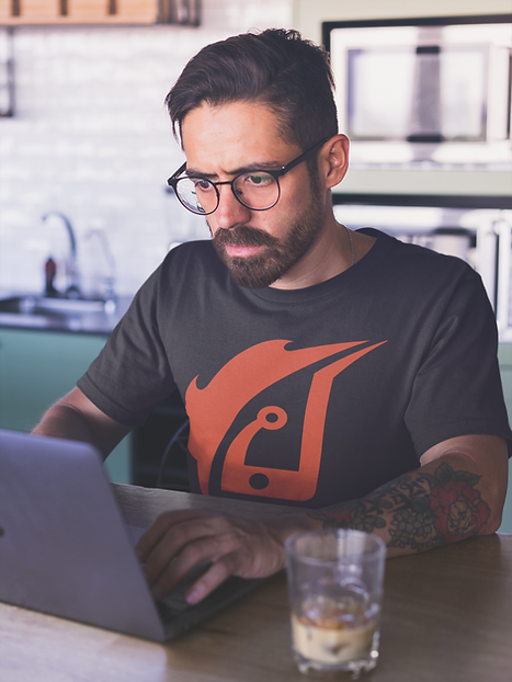 mockup-of-a-man-wearing-a-t-shirt-working-on-his-laptop-a20404.png