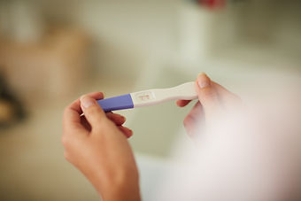 positive-result-pregnancy-test-held-in-two-hands-2026-03-25-03-01-02-utc.jpg