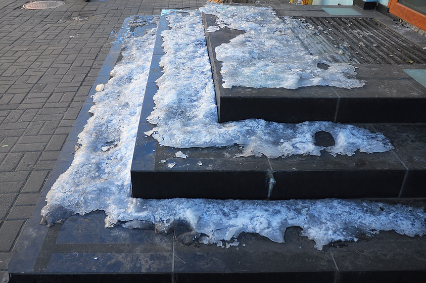 Stairs to entrance coved in snow and ice after freezing temperatures