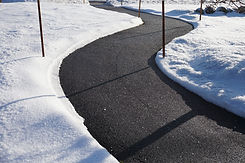 A clear walkway with ice melting salt