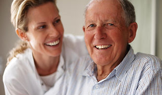 Exceptional Care Unfolds: Client and caregiver share smiles, embodying dedication and empathy at our home care agency's core.
