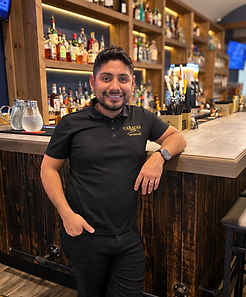 Warm Portrait Behind the Bar.png