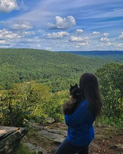 Me and my cat Taz looking at mountains on a hike