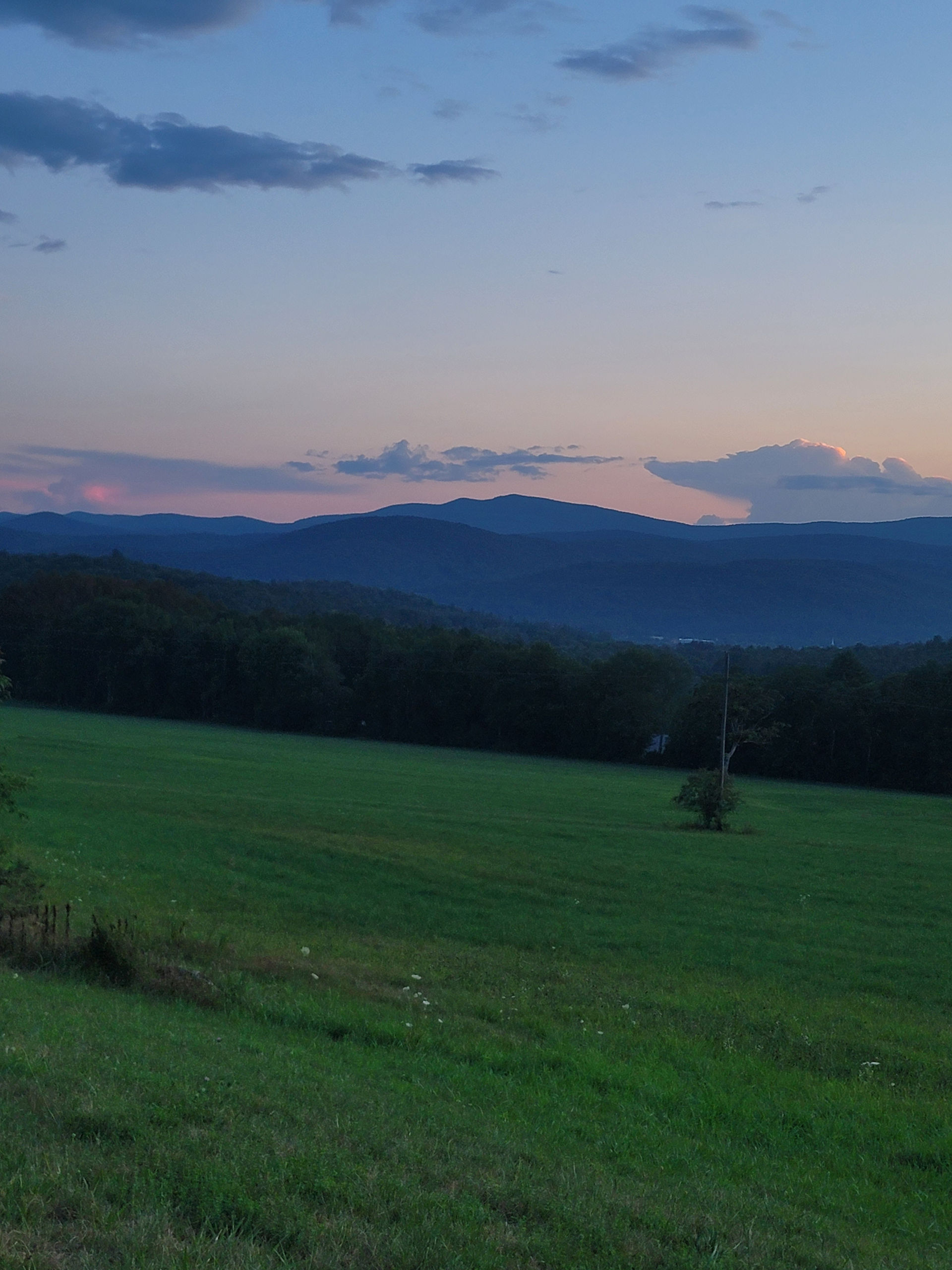 sunset in the green mountains of vermont in the summer