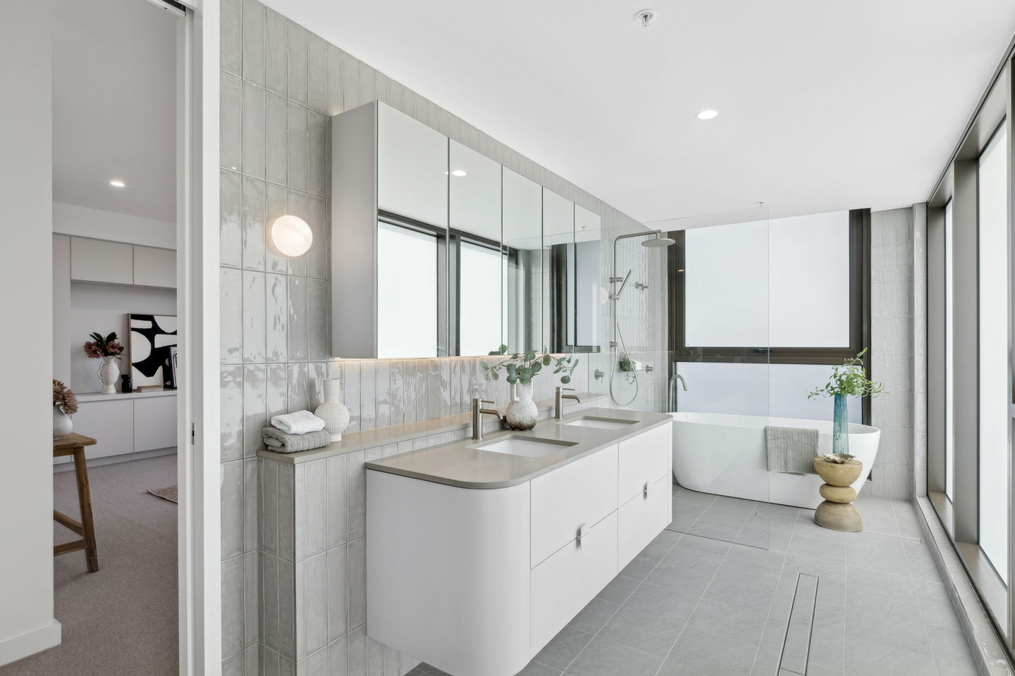 Modern bathroom with sleek design and neutral colors.