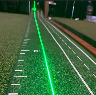 PuttAim alignment tool projecting laser line for putting stroke training.