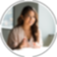 An image of a women, an HR professional, smiling and talking with someone.